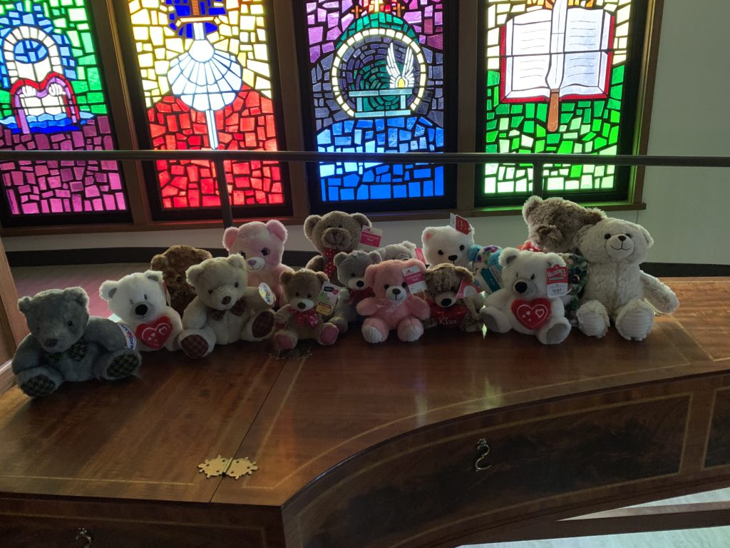 stuffed bears sitting on the harpsicord